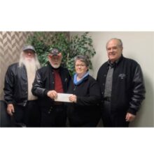 Flaming Pistons Car Club with check for Fueling Kids' Futures of Waterford